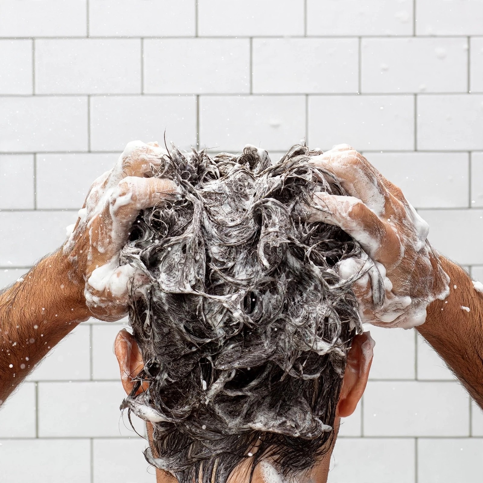 Close view of shampoo lather on skin and hair.